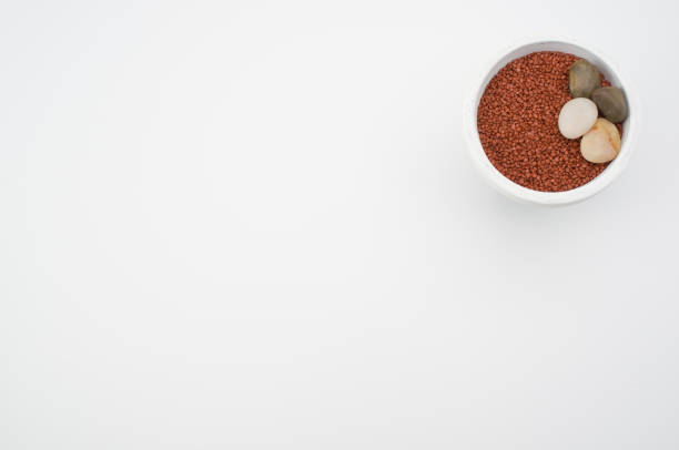 istock Ceramic vase with decorative sand and pebble stones on white background with copy space 1465830657