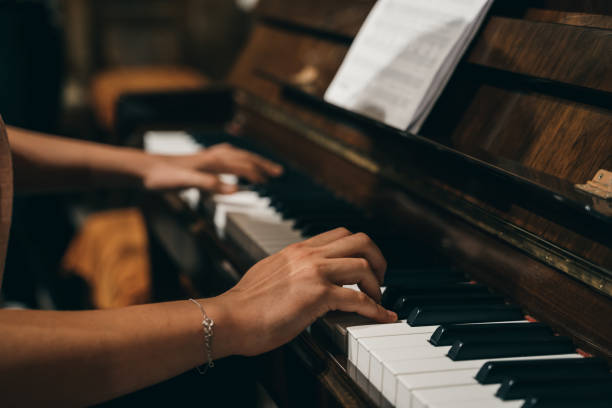 istock Female's hands playing the piano 1465831856