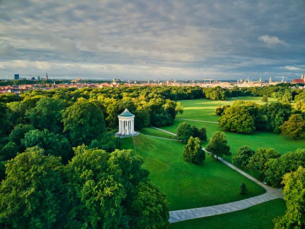 Monopteros in English Garden. Replica Greek temple with garden views build in 19th century in Munich central Park. Aerial drone shot during summer