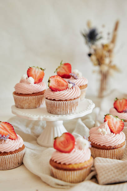 istock Vertical shot of delicious strawberry cupcakes 1465834401