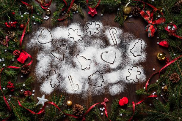 istock Christmas background with mini cookie cutters and season decorations 1465835402