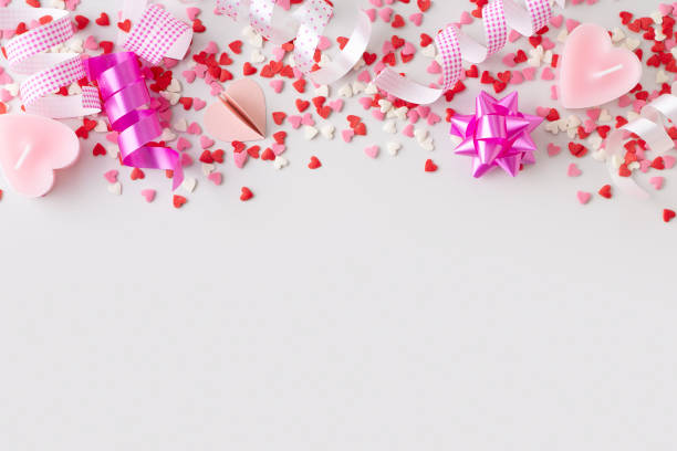 istock Celebration concept with pink confetti and event decoration on white background 1465841550