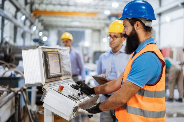 istock Group of engineers and contractors using robots and automated production process in factory 1465845992