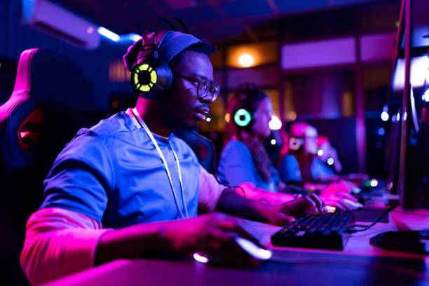 istock Concentrated African American gamer playing multiplayer online game on PC. 1465847176