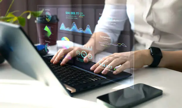 Photo of Advisor using KPI Dashboard on virtual screen.Business finance data analytics graph.Financial management technology.