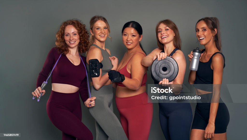 Five Young Women In Sports Clothes And Gym Accessories In Studio Shot Stock  Photo - Download Image Now - iStock