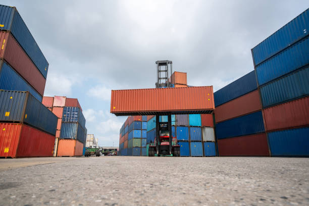 istock Cargo container for overseas shipping in shipyard with heavy machine . Logistics supply chain management and international goods export concept . 1465858161
