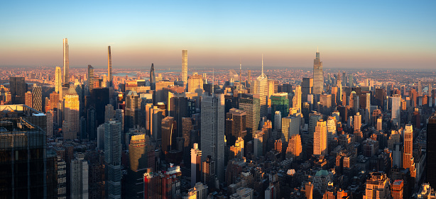 New York City elevated panoramic view of midtown Manhattan skyscrapers at sunset. USA