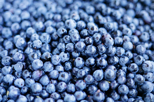 Mix of berries. Raspberries, blueberries and blackberries on a white background. Isolated.