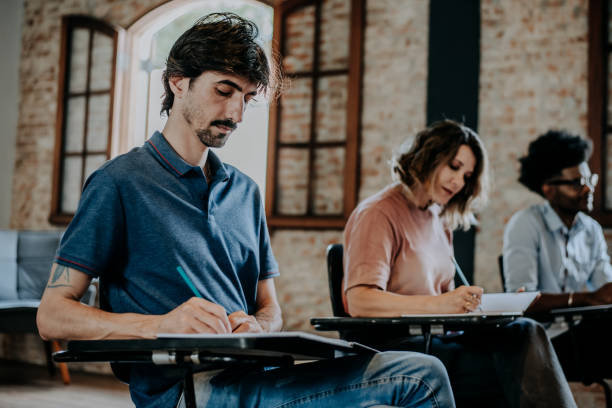 istock Portrait of a student man in the classroom 1465886150
