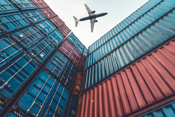 istock Freight airplane flying above overseas shipping container . Logistics supply chain management and international goods export concept . 1465888389