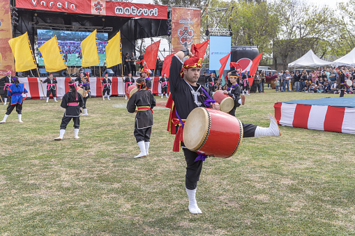 Buenos Aires, Argentina - February 14th, 2023: Japanese young man with drum. Eisa (Japanese dance with drums) in Varela Matsuri.