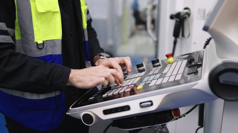 Cnc Operator Programming The CNC Machine In The Factory