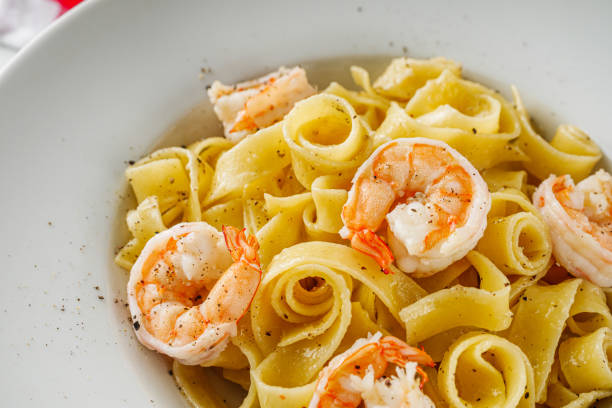 istock delicious shrimp fettuccine alfredo pasta on a white rustic background 1465894817