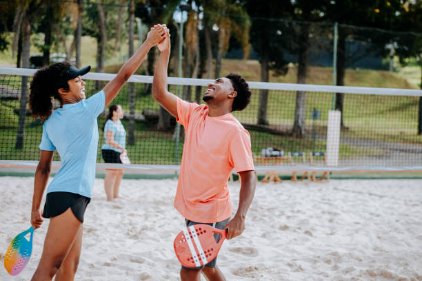 istock Small group of people playing Beach Tennis 1465896211