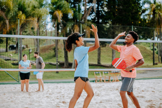 istock Small group of people playing Beach Tennis 1465896257