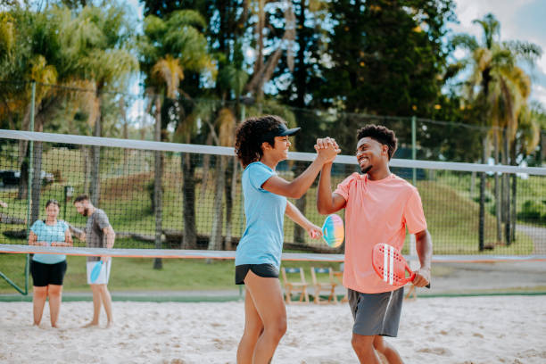 istock Small group of people playing Beach Tennis 1465896277