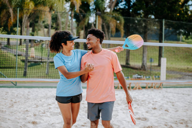 istock Couple playing beach tennis 1465896278