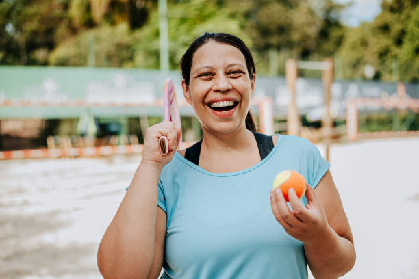 istock Woman playing beach tennis 1465896414
