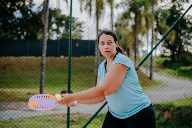 istock Woman playing beach tennis 1465896518