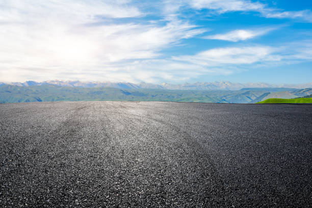 istock Asphalt road with green mountain background 1465900441