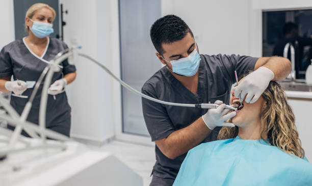 istock Woman having teeth examined 1465901640
