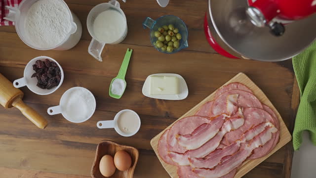 Slow motion view of panning view of ingredients for ham bread baking or 