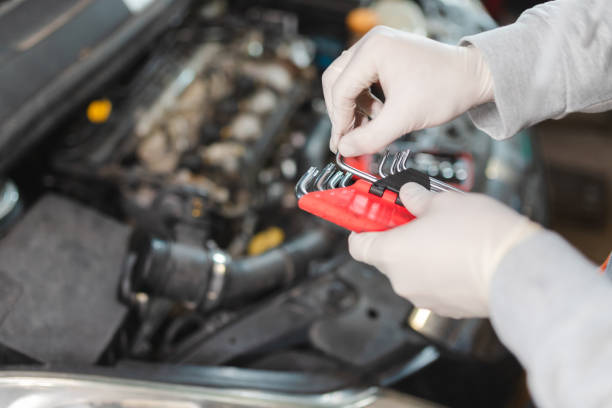 istock Close-up of a mechanic picking out the right tool while working on a car engine 1465908557