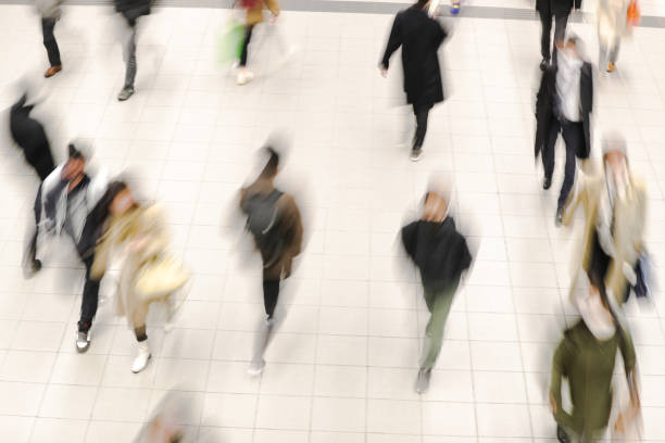 istock Blurred moving groups of people 1465908862