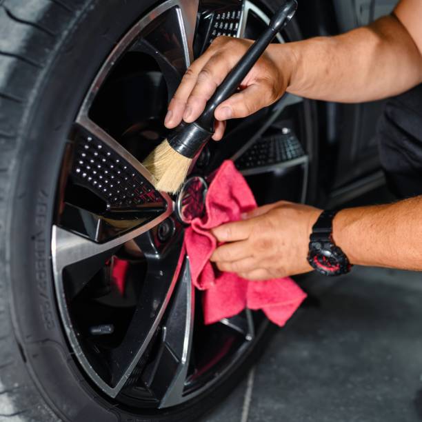 istock Professional worker cleaning car rim 1465911433