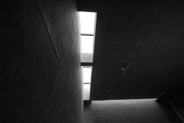istock A corner of ceiling wall of gray concrete building 1465919219