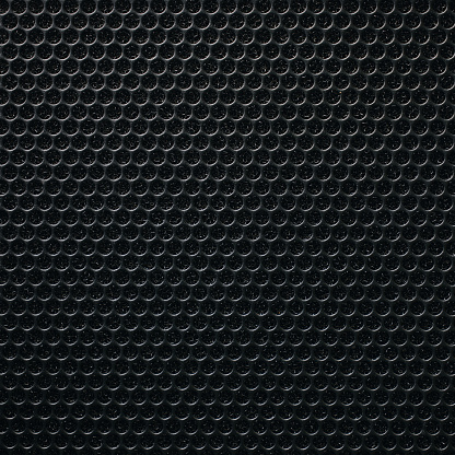 Safety net on the music speaker. Protective grid audio speakers. Close view of Black safety net. Metal perforated mesh, abstract pattern, Abstract black background. Professional audio equipment.