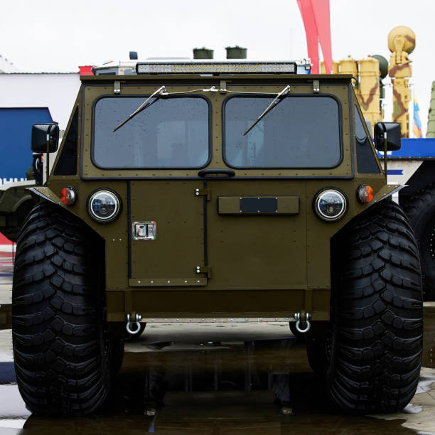istock All-terrain vehicle on Low pressure tires, with automatic tire pumping system. Extreme potency. Giant Wheels of an all-terrain vehicle. ATV monster car 1465921009