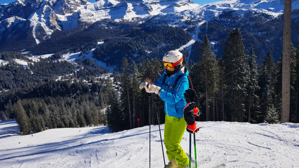 istock Woman alpine skier getting ready for a fun ride 1465924549