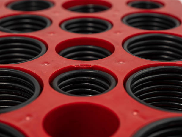 Hydraulic and pneumatic o-rings in black in different sizes on a white background. Rubber gaskets for plumbing.