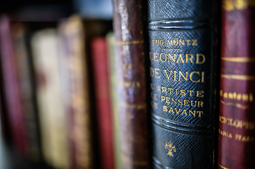 Antique 19th century books in bookshelf