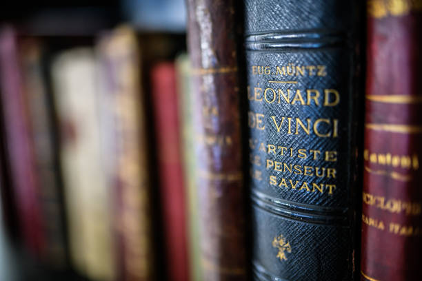 Antique 19th century books in bookshelf stock photo