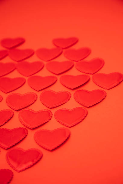 Valentine’s day composition with red heart shape on white canvas background.\nHorizontal composition with copy space. Love and Valentine's Day concept.