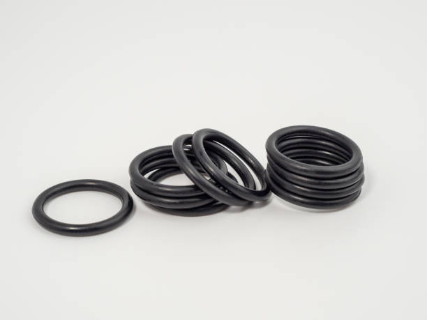 istock Hydraulic and pneumatic o-rings in black in different sizes on a white background. Rubber gaskets for plumbing. 1465933682