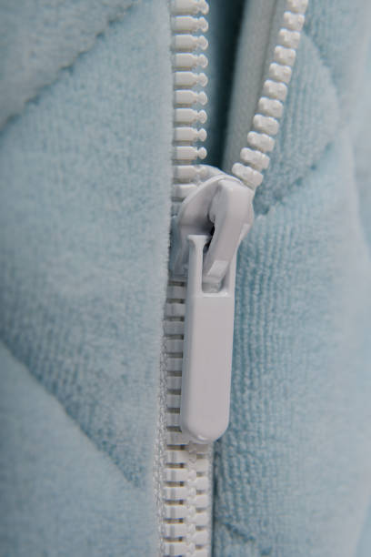 istock Close-up of a zipper on a textured blue sweatshirt. 1465934023