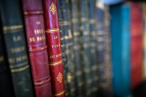 Antique 19th century books in bookshelf