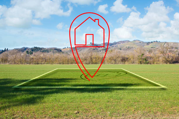 istock Land plot management - real estate concept with a vacant land parcel available for building construction - housing concept with a red house icon 1465943399