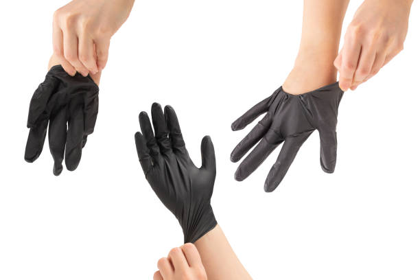 istock Woman puts on black rubber gloves. 1465944614