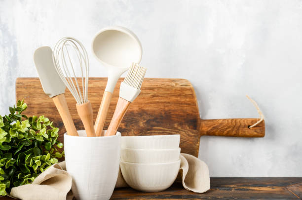 istock Background with kitchen utensils standing on wooden countertop. 1465948532