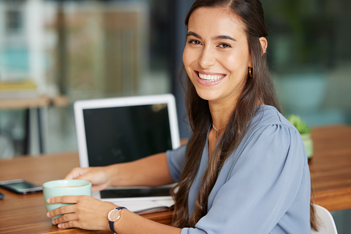 Coffee shop, laptop and face of woman with remote work, online management career and virtual networking job with smile. Happy woman working in a restaurant or cafe with coffee break and portrait