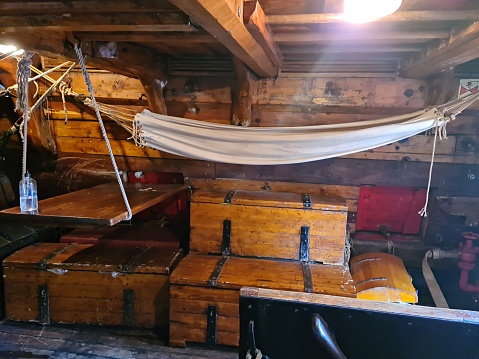 Internal living cabin for the crew on a wooden sailing ship.