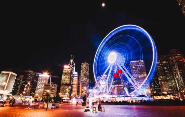 istock Ferris wheel in big city at night 1465952137