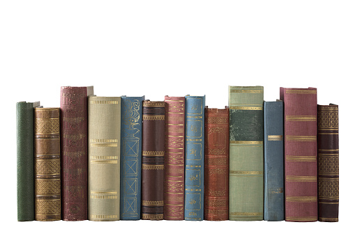 Old books in the row isolated on white background