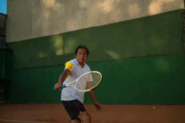 Tennis coach playing