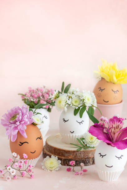 istock Funny Easter eggs with painted cute face and flowers 1465954038